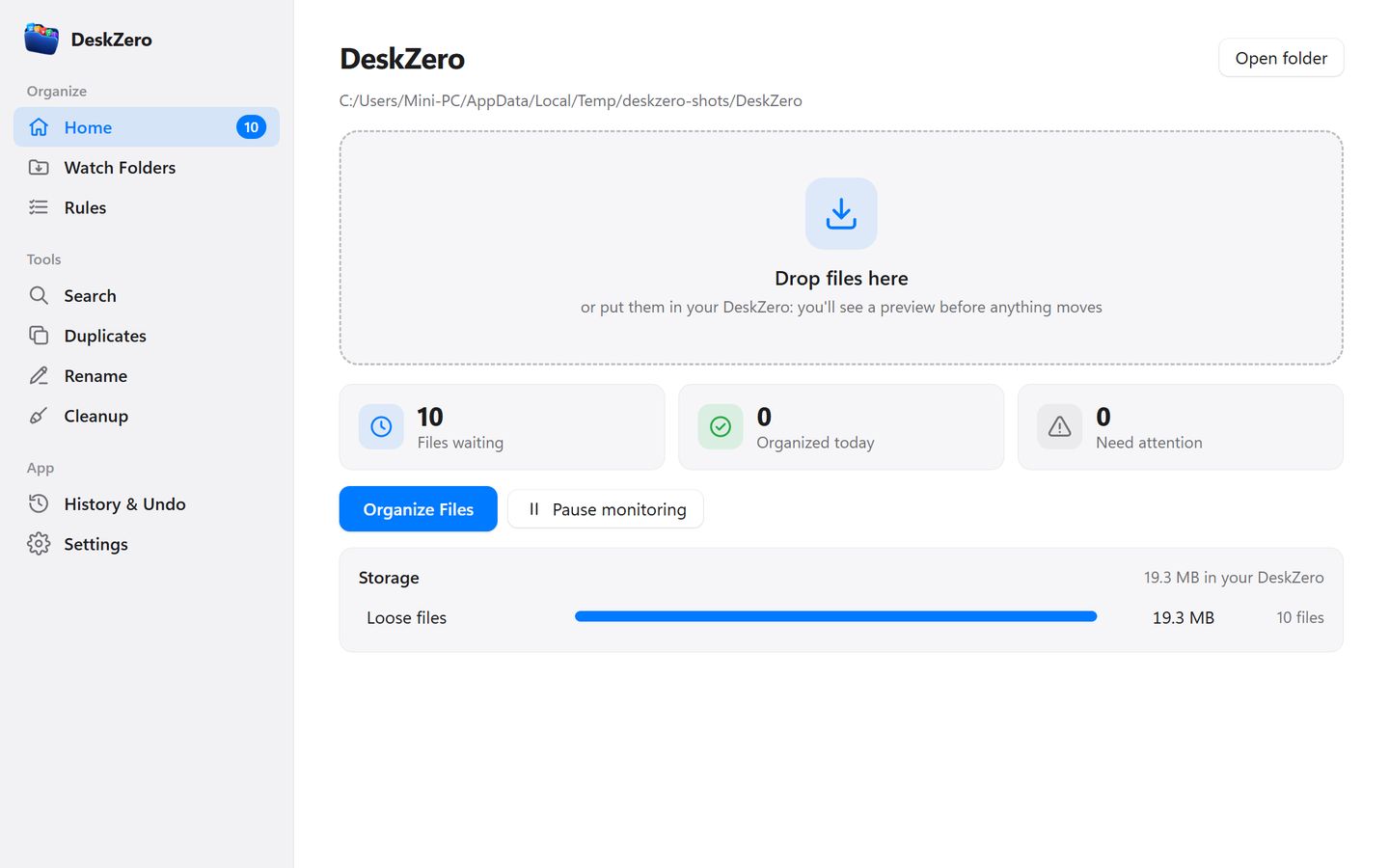 DeskZero home screen: a sidebar with Home, Watch Folders, Rules and tools, a Drop files here area, and counters for files waiting, organized today and needing attention.